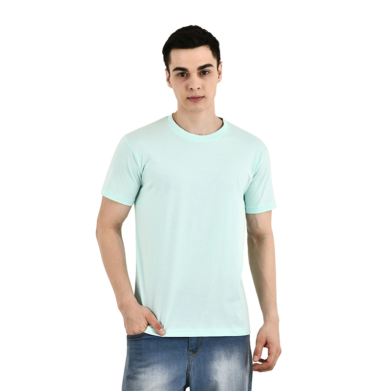 Male model in solid mint green round-neck t-shirt with blue denim jeans - menswear ecommerce photography by Lohar Studio Delhi